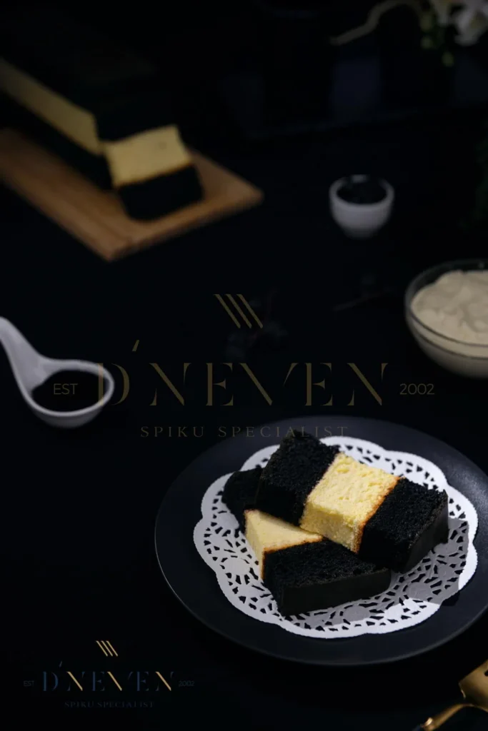 Slices of Spiku Charcoal Cheese with dark charcoal and cheese layers